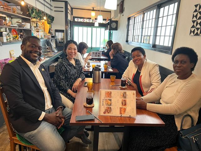Uganda Ambassadors seated together at Kitchen SawaSawa, a Uganda-themed venue in Higashiosaka, Japan
